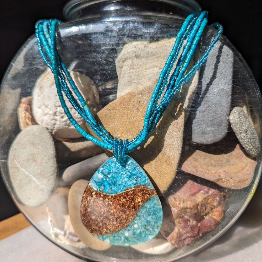 Turquoise and brown beaded pendant necklace